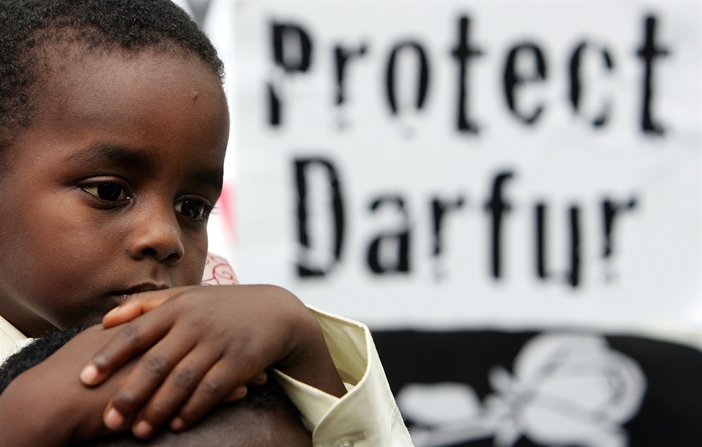 File: Sinean Hamid Sinean, a young survivor of Darfur, at a march to raise awareness about the crisis in Darfur in September 2007, in London. (Photo by Cate Gillon/Getty Images)