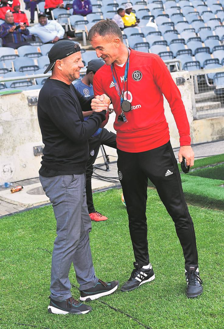 Polokwane City coach Jozef Vukusic (left) exchanging pleasantries with his Orlando Pirates counterpart Milutin Sredojevic at Orlando Stadium. Photo by Themba Makofane