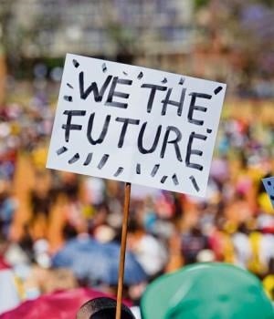 A student holds a banner aloft during the march to the Union Buildings in Pretoria yesterday.