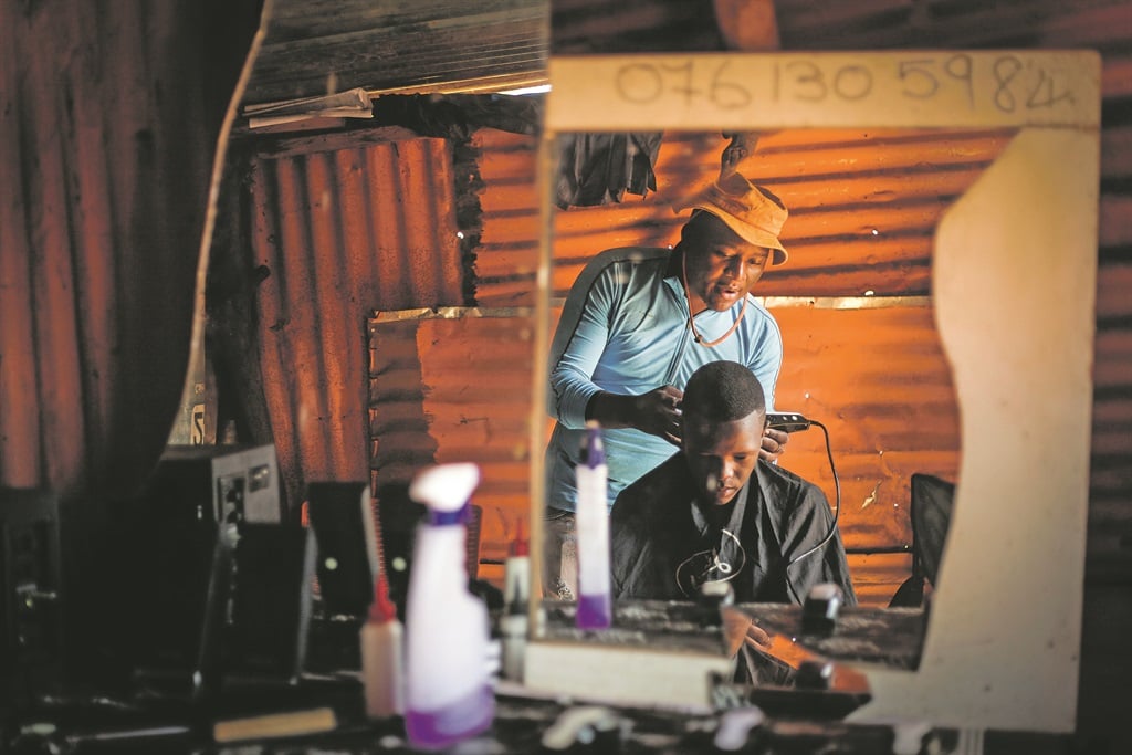 Beware the chiskop Most hairdressers use methylated spirits to disinfect their clippers, and some an open flame, but the efficacy of these methods in killing viruses has not been determined, say researchers Picture: Mpumelelo Buthelezi