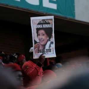 A mourner is seen carrying a portrait of fallen icon Winnie Madikizela-Mandela at Orlando Stadium in Soweto, on Saturday, during her funeral. (Jan Borman, News24)