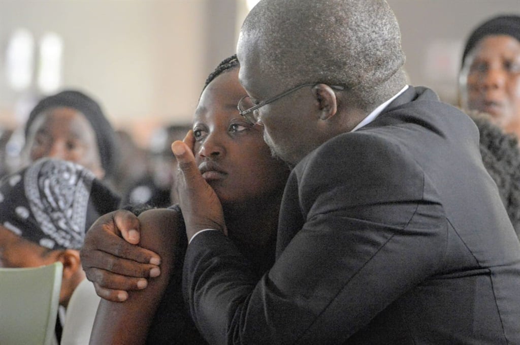 HEARTBREAK: Kgosi's family members struggle to hold back their tears. Photo by Raymond Morare