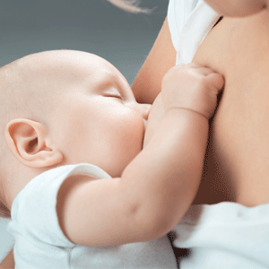 Baby feeds on mom's breasts