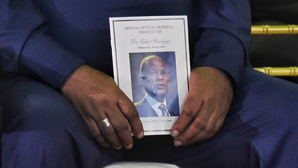 Former defence minister Charles Nqakula holds the programme during the memorial service of Dr Zola Skweyiya. Picture: Tebogo Letsie
