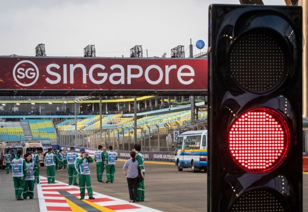 Rescue personnel gather on the track of the Formula 1 Singapore Grand Prix at the Marina Bay Street Circuit in Singapore on September 19, 2019. <i> Image: AFP / Mladen Antonov </i>