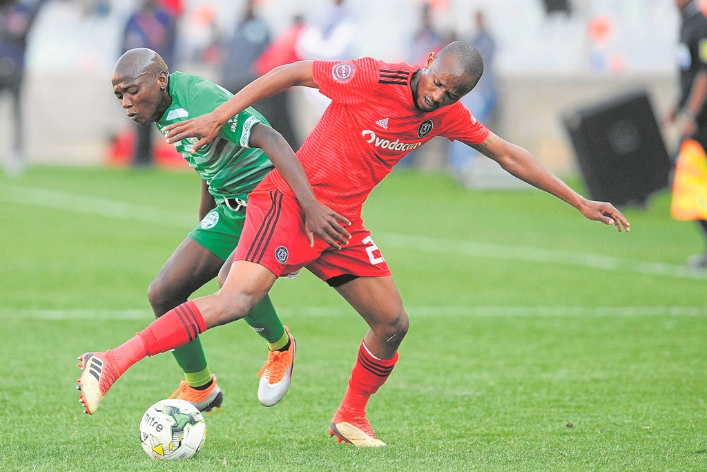 Kabelo Dlamini of Bloemfontein Celtic and Xola Mlambo of Orlando Pirates in a tussle for the ball at Free State Stadium yesterday.Photo by Gallo Images