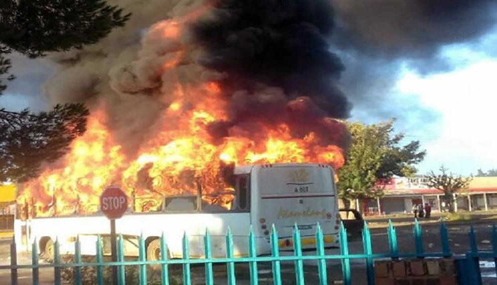A bus, a car and a building burn as residents from Mahikeng and neighbouring villages took to the streets to show their frustration about the leadership of Premier Supra Mahumapelo. Picture: Twitter