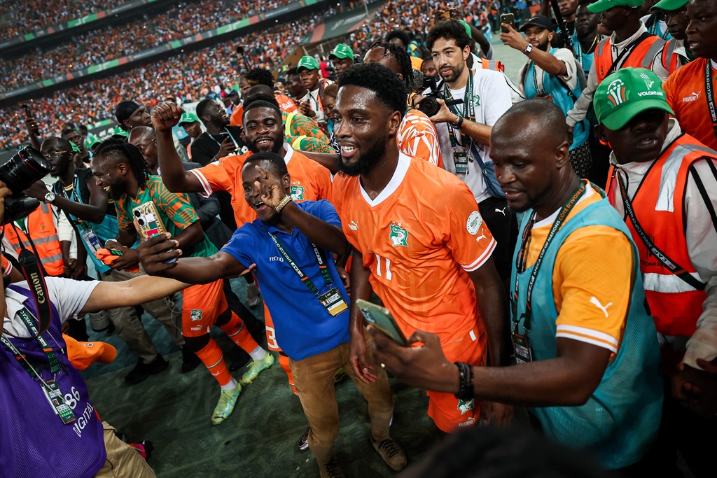 Ivory Coast's players celebrate after winning at the end of the Africa Cup of Nations (CAN) 2024 semi-final football match between Ivory Coast and Democratic Republic of Congo at Alassane Ouattara Olympic Stadium in Ebimpe, Abidjan on 7 February 2024. 