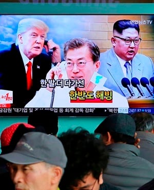 Images of North Korean leader Kim Jong Un, right, South Korean President Moon Jae-in, centre, and US President Donald Trump ahown on TV at the Seoul Railway Station in Seoul, South Korea. (Ahn Young-joon, AP, File)
