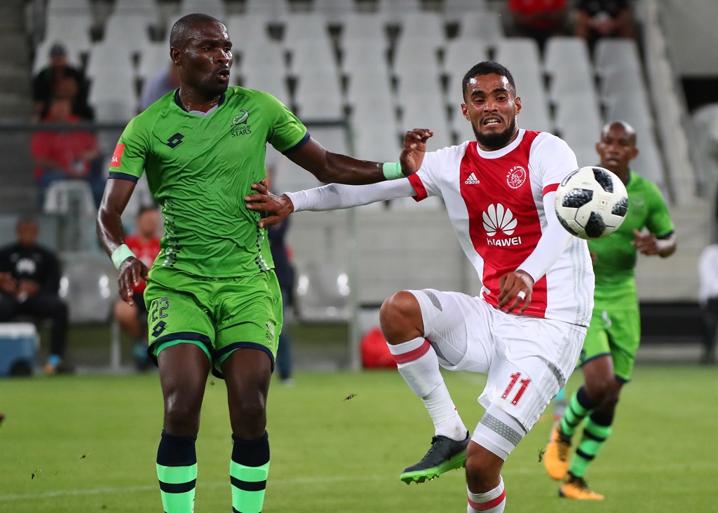 Tashreeq Morris of Ajax Cape Town challenged by Robert Ng’ambi of Platinum Stars