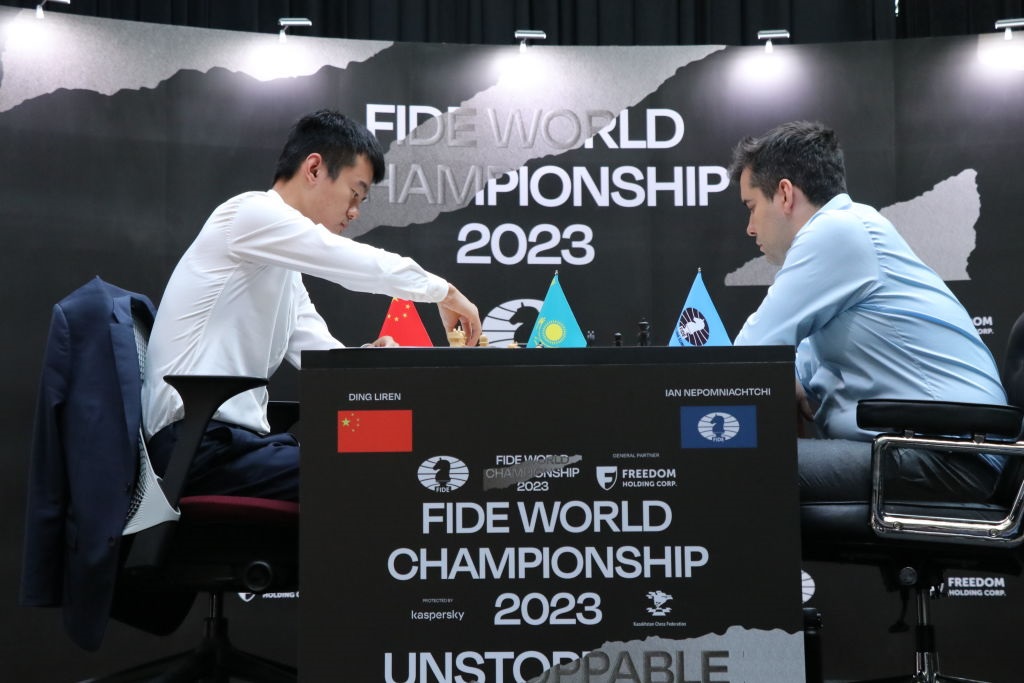 Grandmaster Ding Liren (L) of China plays against grandmaster Ian Nepomniachtchi of Russia during the 2023 World Chess Championship.