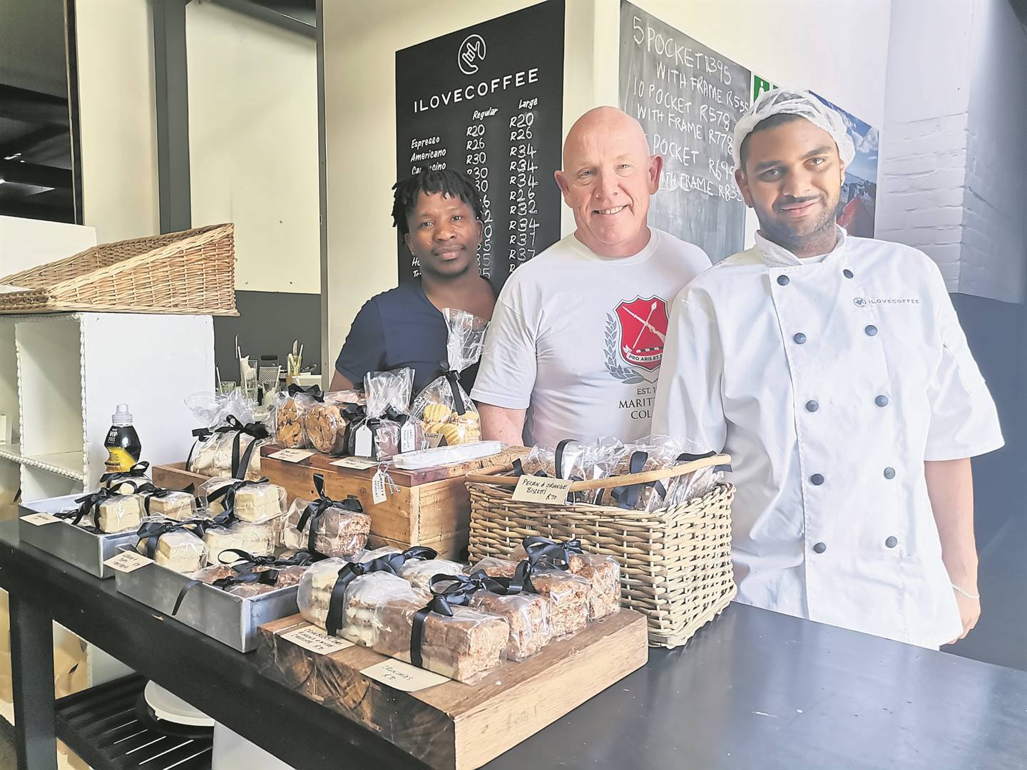 Stura Mthuthuzeli, barista; Gary Hopkins, co-founder, and Kurt Baptiste, kitchen hand; at I Love Coffee in Claremont. PHOTO: Nettalie Viljoen
