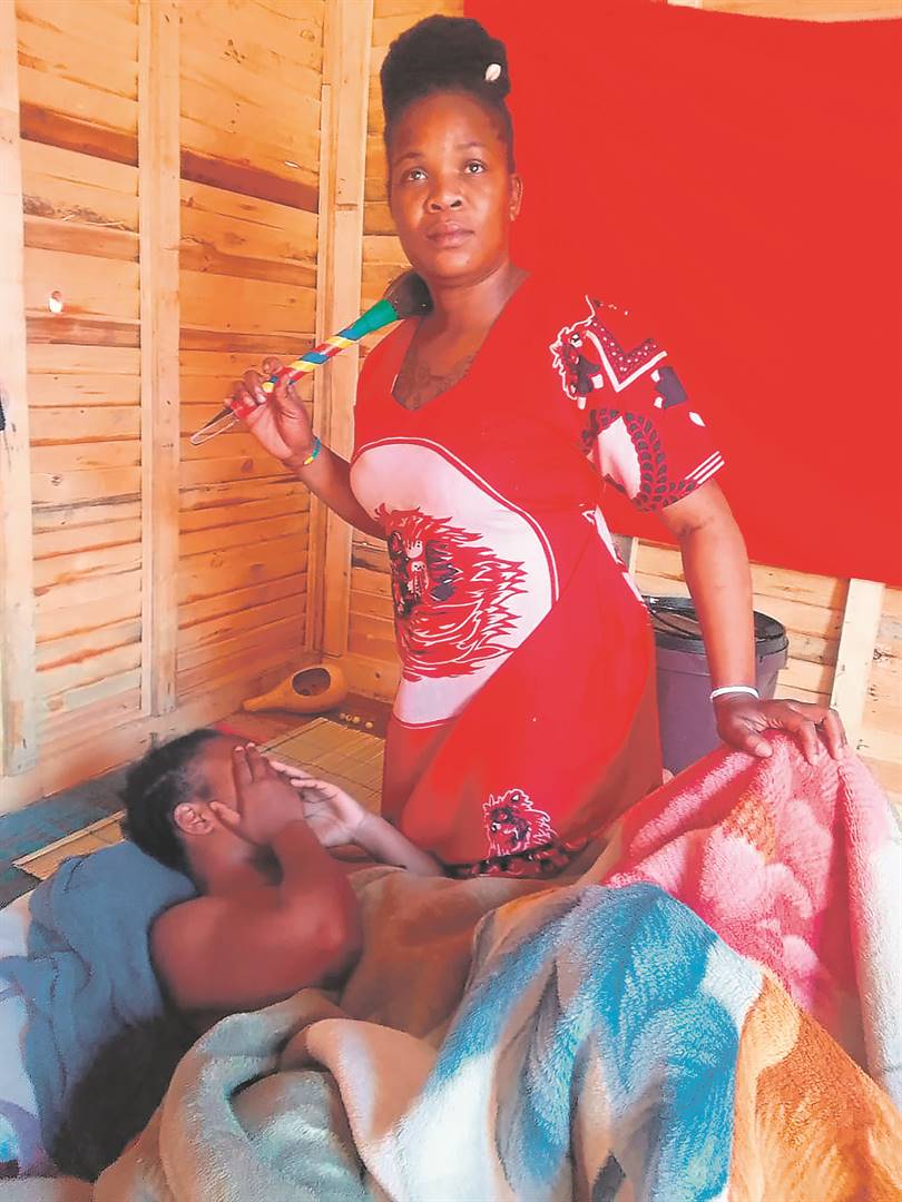WHY ME?: Sangoma Mamsy Magwaza from Kalafong Heights, west of Tshwane, with a 29-year-sex worker whom she’s helping to heal. Photo by Raymond Morare