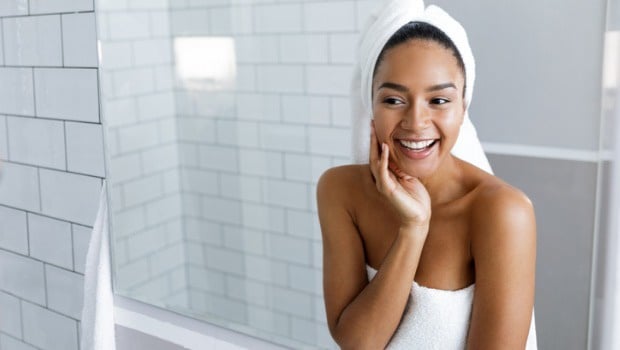 Applying skin products for an evening beauty ritual