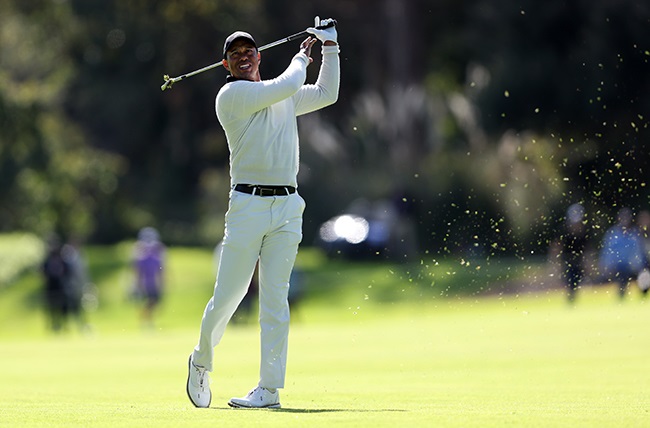 Tiger Woods plays a shot on the 18th hole during the first round of The Genesis Invitational at Riviera Country Club in Pacific Palisades on 15 February 2024. (Photo by Michael Owens/Getty Images) 