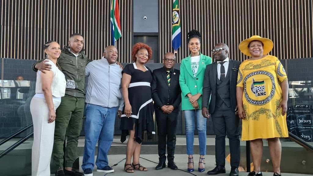 The ANC's new Johannesburg mayor Dada Morero, flanked by his coalition partners. 