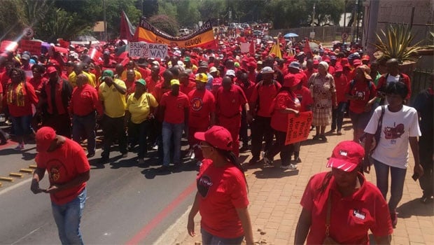 Some of the strikers who have braved the 35°C heat in Johannesburg to march for better wages and against e-tolls, amongst other things. Photo by Mpho Raborife. <br />