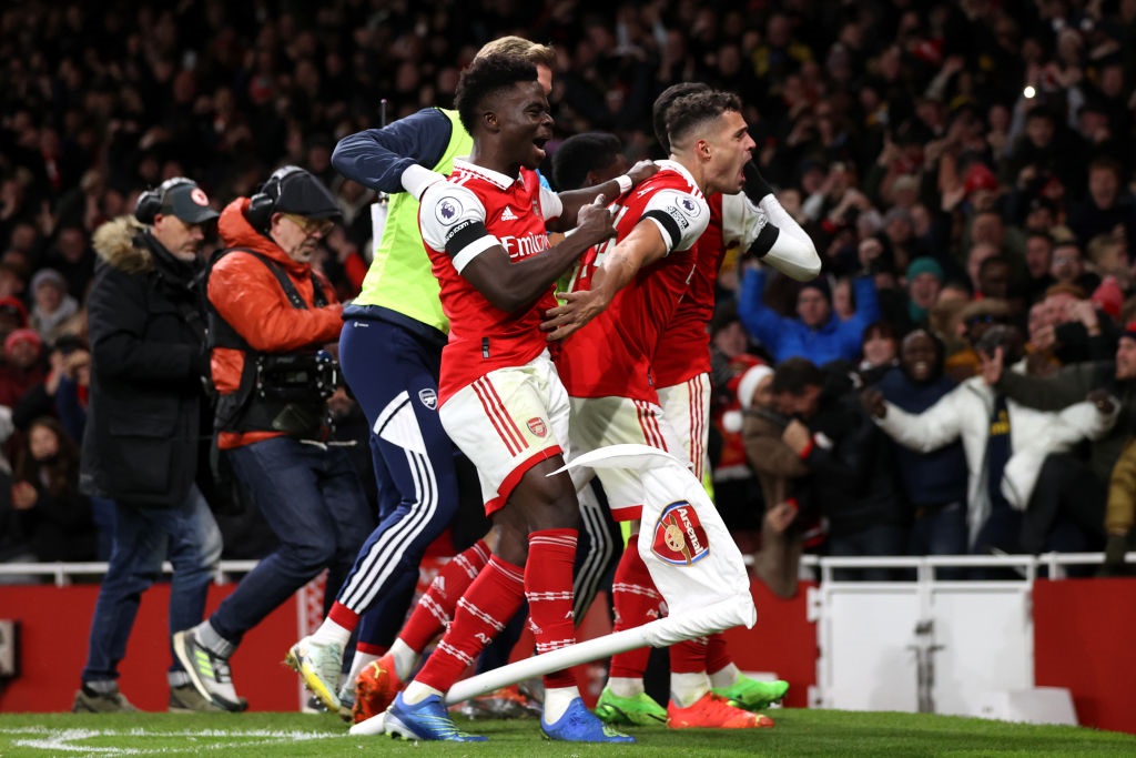 LONDON, ENGLAND - DECEMBER 26: Gabriel Martinelli of Arsenal celebrates with teammates Bukayo Saka and GranitÂ Xhaka after scoring their sides second goal during the Premier League match between Arsenal FC and West Ham United at Emirates Stadium on December 26, 2022 in London, England. (Photo by Alex Pantling/Getty Images)