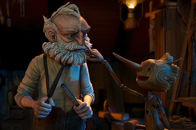 Gepetto (voiced by David Bradley) and Pinocchio (v