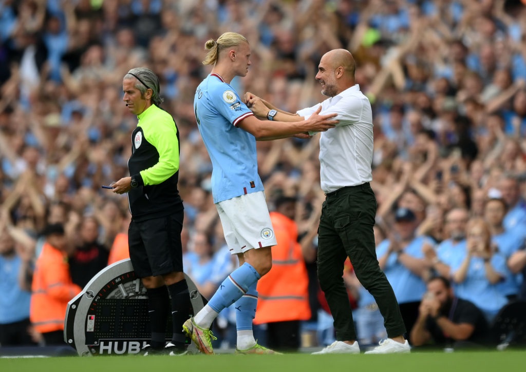MANCHESTER, ENGLAND - AUGUST 27:  Erling Haaland of Manchester City interacts with Pep Guardiola, Manager of Manchester City during the Premier League match between Manchester City and Crystal Palace at Etihad Stadium on August 27, 2022 in Manchester, England. (Photo by Shaun Botterill/Getty Images)