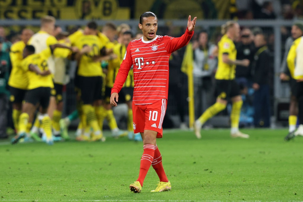 DORTMUND, GERMANY - OCTOBER 08: Leroy Sane of Bayern Munich reacts after Anthony Modeste of Borussia Dortmund (not pictured) scored their sides second goal during the Bundesliga match between Borussia Dortmund and FC Bayern Muenchen at Signal Iduna Park on October 08, 2022 in Dortmund, Germany. (Photo by Alexander Hassenstein/Getty Images)