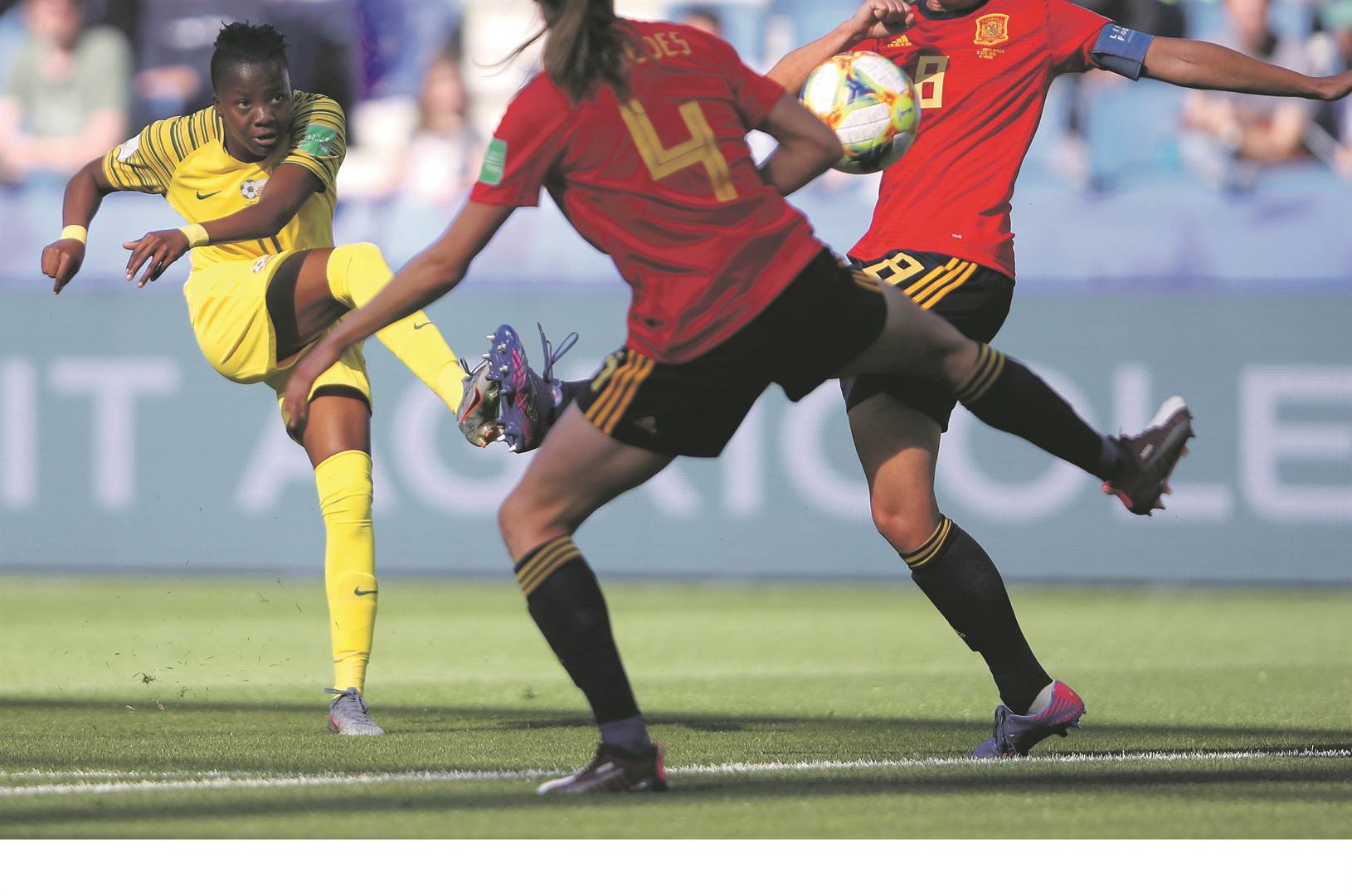 Thembi Kgatlana smashes the ball past two Spain players to open Banyana Banyana’s goal account at the Fifa Women’s World Cup in France.  Photo by Getty Images