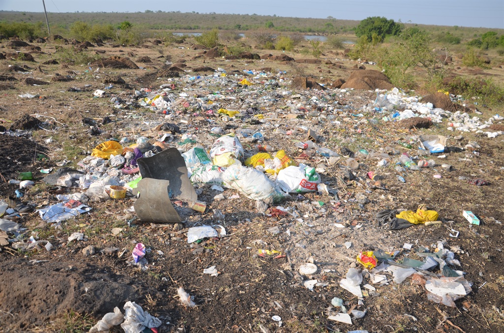Disposal pampers and beer bottles  thrown near the village dam
