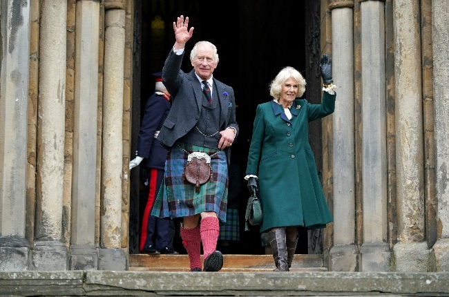 King Charles and Camilla, Queen Consort, wave to crowds during a visit to Scotland in early October. The couple will be crowned in May next year. (Photo: Getty Images/Gallo Images)