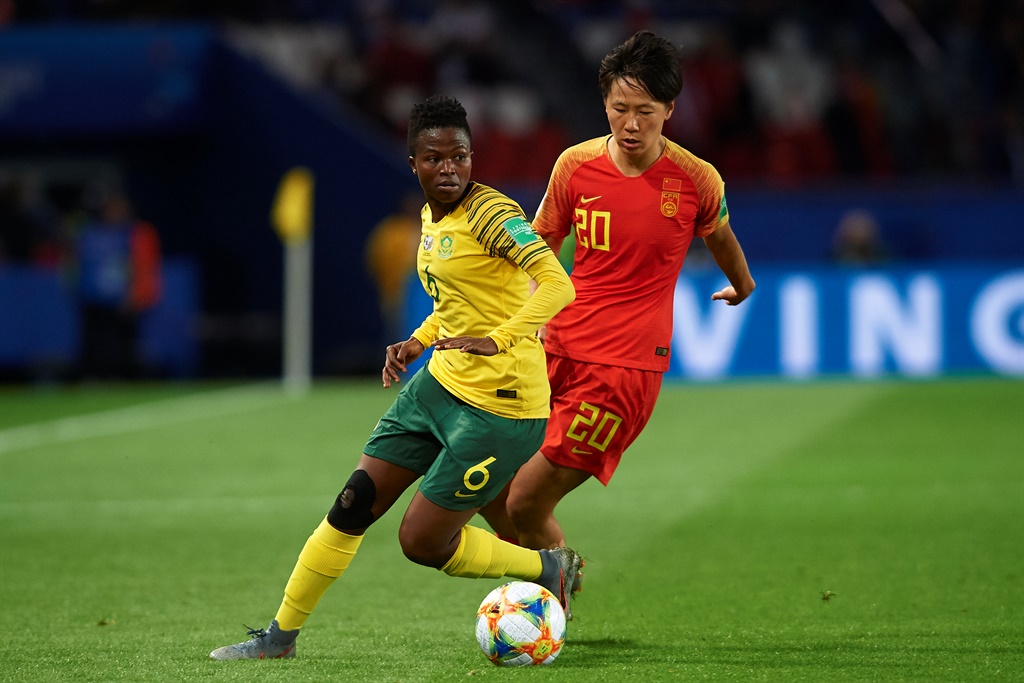 Mamello Makhabane of South Africa competes for the ball with Zhang Rui of China PR during the 2019 FIFA Womens World Cup in France 