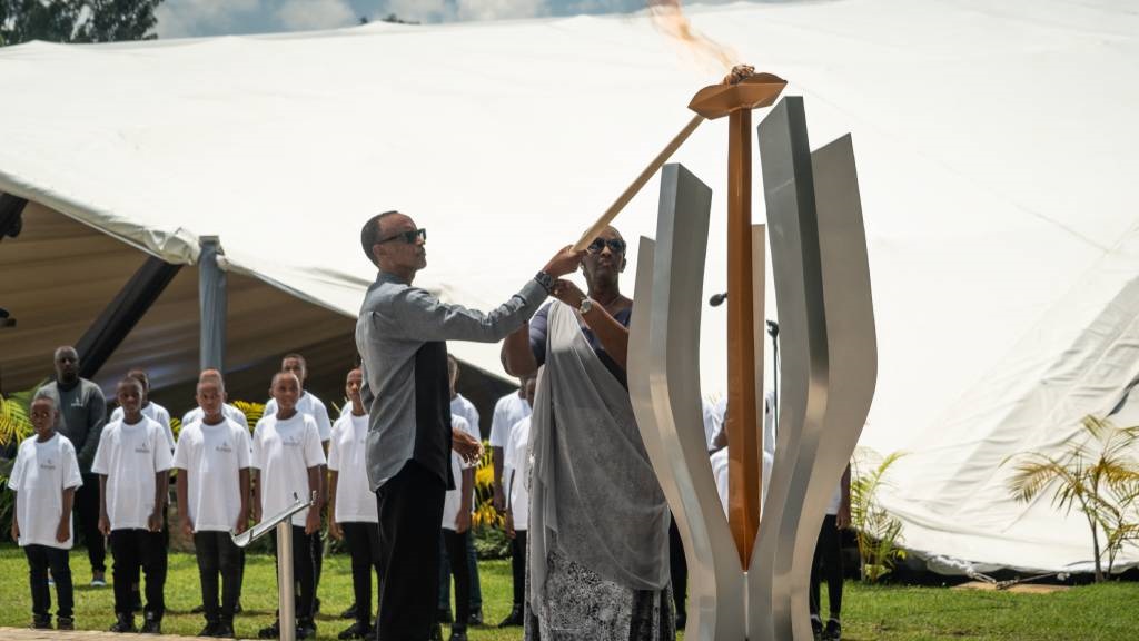 Rwandan President Paul Kagame (L) and Rwanda First Lady Jeannette Kagame light the flame of remembrance during the 29th commemoration ceremony for the 1994 Genocide at Gisozi Genocide Memorial in Kigali.