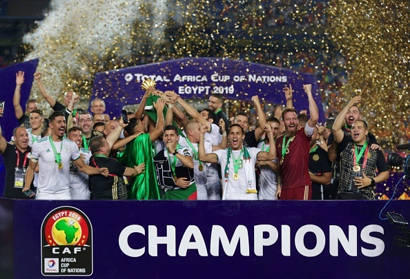 Algerian team celebrate championship with trophy after the 2019 Africa Cup of Nations final match between Senegal and Algeria at the Cairo Stadium in Cairo, Egypt on July 19, 2019. 