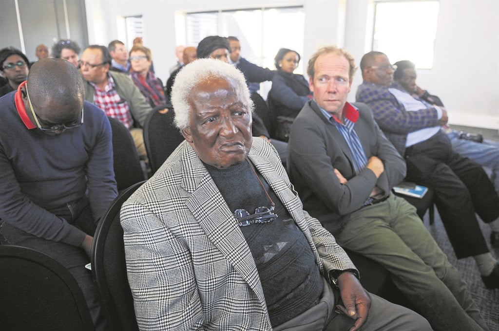 Veteran photographer Peter Magubane and others at the memorial service of Sam Nzima.