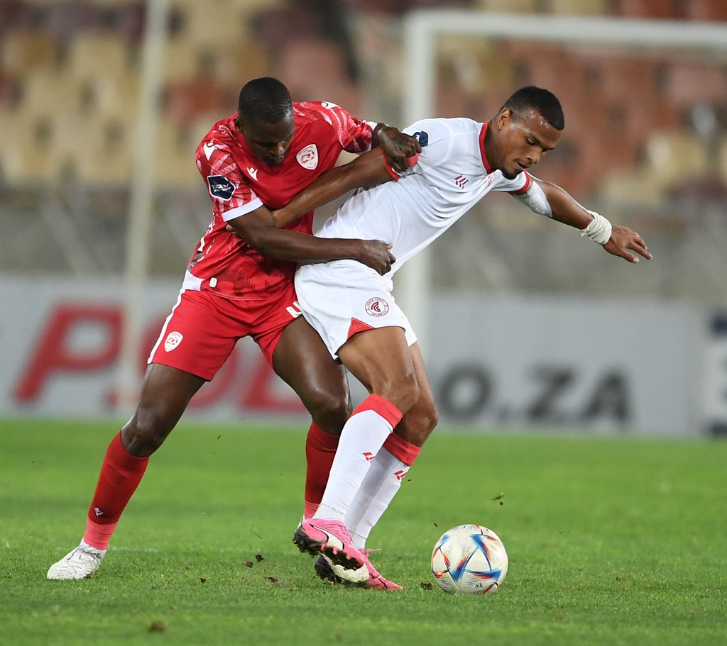 POLOKWANE, SOUTH AFRICA - APRIL 20: Katlego Mohamme of Sekhukhune United and Ashley Cupido of Cape Town Spurs during the DStv Premiership match between Sekhukhune United and Cape Town Spurs at Peter Mokaba Stadium on April 20, 2024 in Polokwane, South Africa. (Photo by Philip Maeta/Gallo Images)