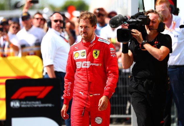 Sebastian Vettel of Ferrari walks in to parc ferme to swap the 1st and 2nd place boards after the F1 Grand Prix of Canada at Circuit Gilles Villeneuve. <i> Image: Dan Istitene Getty</i>