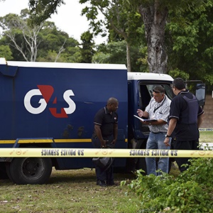 Security officers and officials stand outside a G4S truck after a cash-in-transit heist at Walmer on March 02, 2017 in Port Elizabeth. Picture: Gallo Images