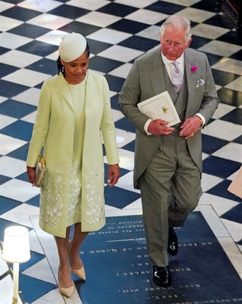 <p>Meghan's mother, Doria Ragland and Prince Charles leave St George's Chapel.</p><p></p>