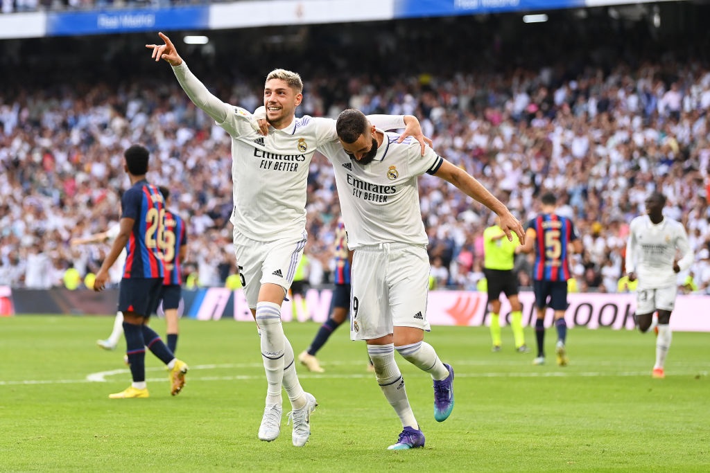 MADRID, SPAIN - OCTOBER 16: Federico Valverde of Real Madrid celebrates with teammate Karim Benzema after scoring their teams second goal during the LaLiga Santander match between Real Madrid CF and FC Barcelona at Estadio Santiago Bernabeu on October 16, 2022 in Madrid, Spain. (Photo by David Ramos/Getty Images)