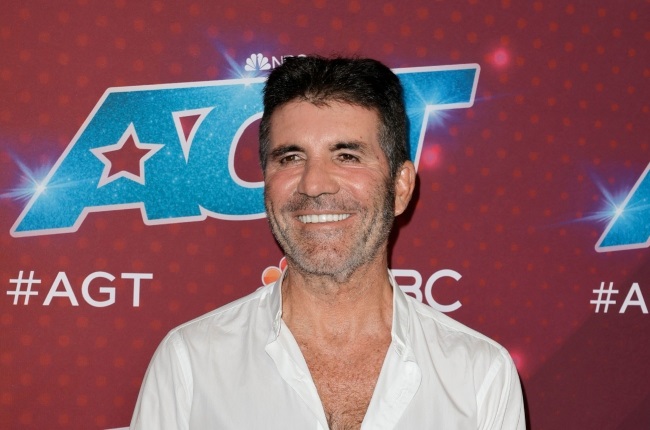 Music mogul Simon Cowell has ditched his hyper-critical reality TV persona for a softer, kinder version of himself. (PHOTO: Gallo Images / Getty Images)