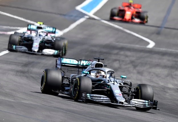 Mercedes British driver Lewis Hamilton (front) leads ahead of Mercedes Finnish driver Valtteri Bottas and Ferraris Monegasque driver Charles Leclerc during the Formula One Grand Prix de France at the Circuit Paul Ricard in Le Castellet, southern France, on June 23, 2019. (Photo by GERARD JULIEN / AFP)