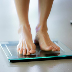 Researchers suggest we should step away from the scale and determine health by where our fat is located instead. 