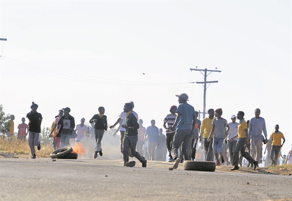 Pupils from Magaliesburg Secondary School, supported by those from Ithuteng, and the community, were up against the police yesterday.Photo by Trevor Kunene