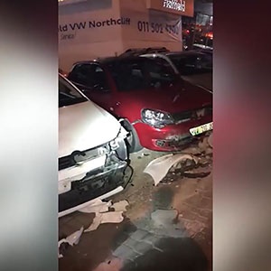 The damage to the showroom vehicles after the incident.