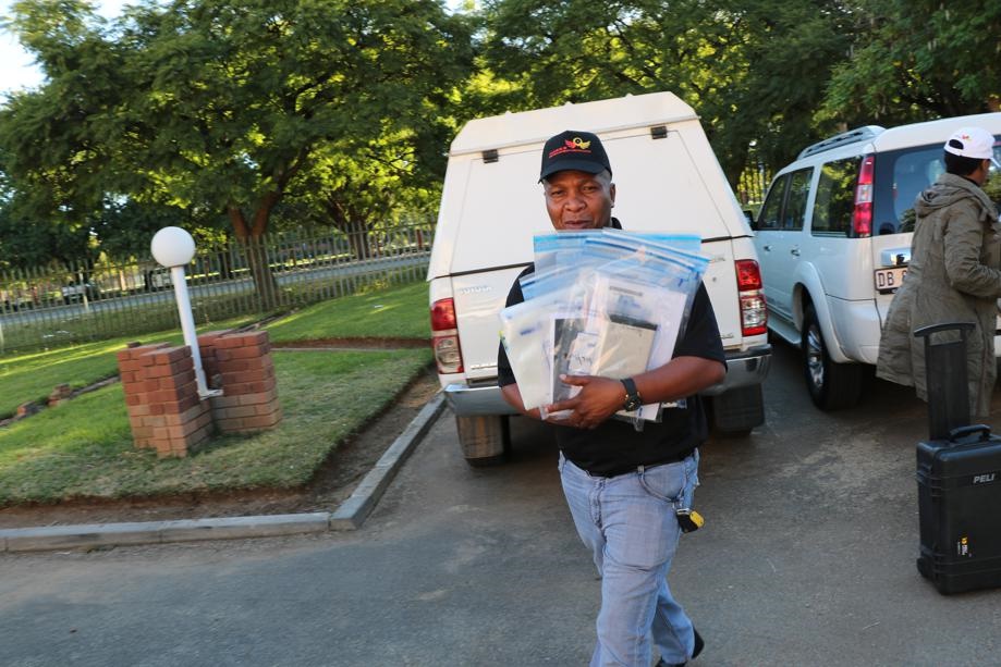 The elite police unit spent most of yesterday sifting through documents and laptops at the North West Department of Agricultural Development’s offices. Photo by   Suluyman Thebeeagae