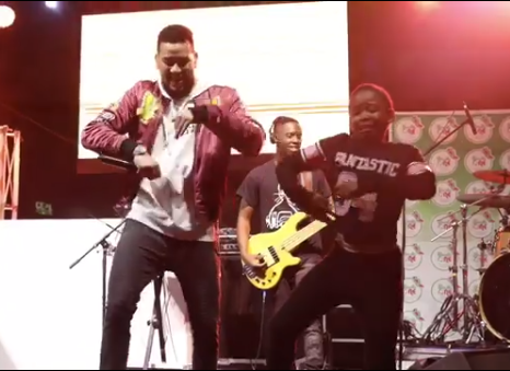 AKA performing with a young fan. Photo: Screengrab from the video