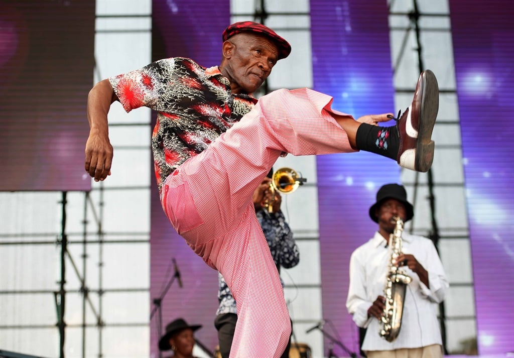 A member of the El Chan band throws some serious dance moves during their performance at the Moretele Tribute Concert in Mamelodi. Photo: Tebogo Letsie