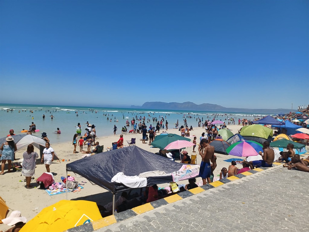 WATCH | Beach please! Capetonians cool off in the sea as temperatures soar in Mother City - News24
