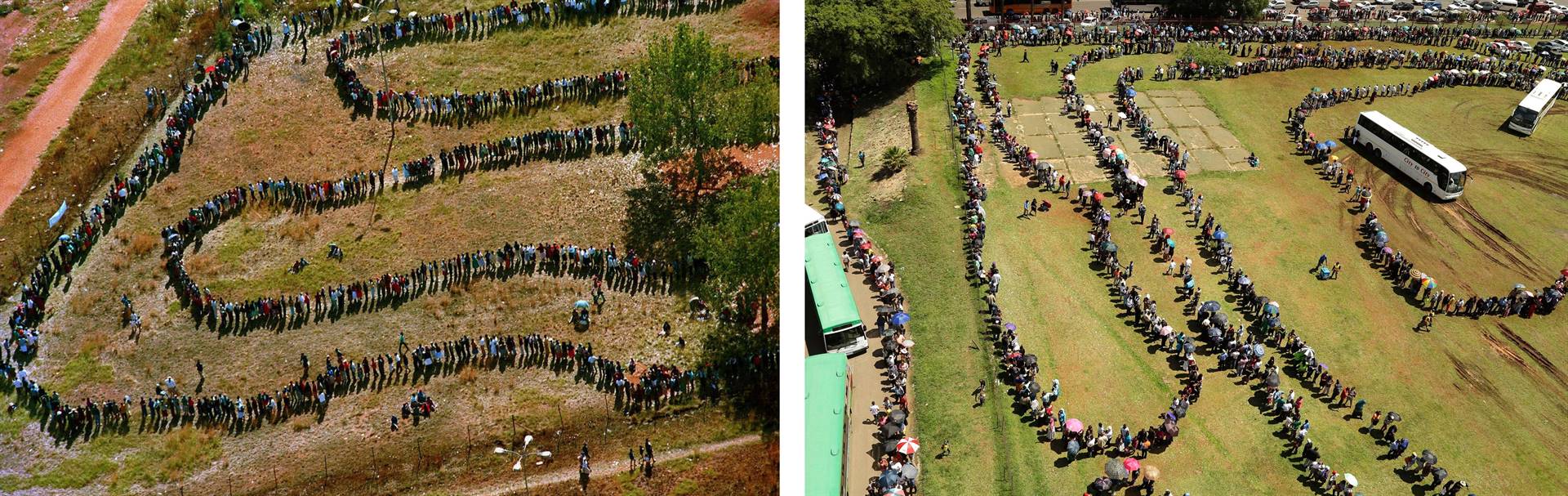 Long queues of people wait outside the polling station in Soweto during the first all-race elections in 1994 