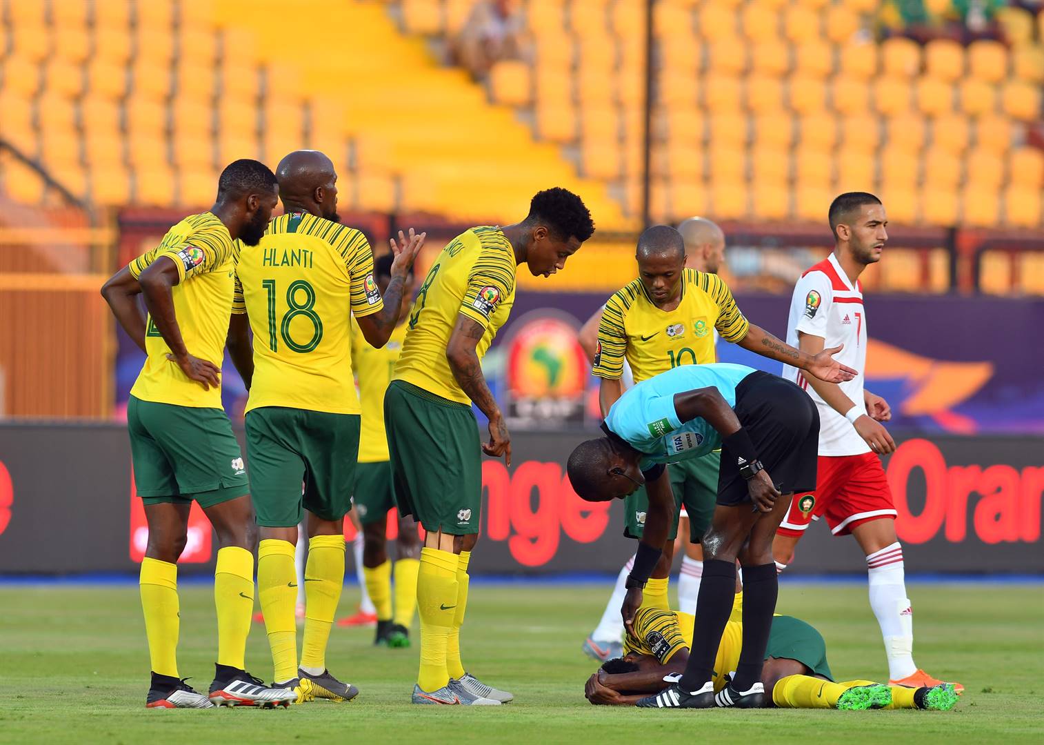 Percy Tau lies injured during the African Cup of Nations match between South Africa and Morocco at Al-Salam Stadium on July 1 2019 in Cairo. Picture: Ahmed Hasan/Gallo Images
