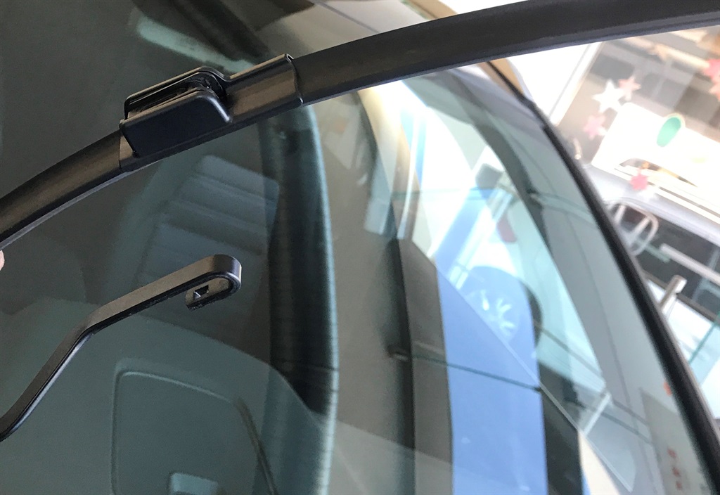 Many wiper blades are retained by a simple hook an