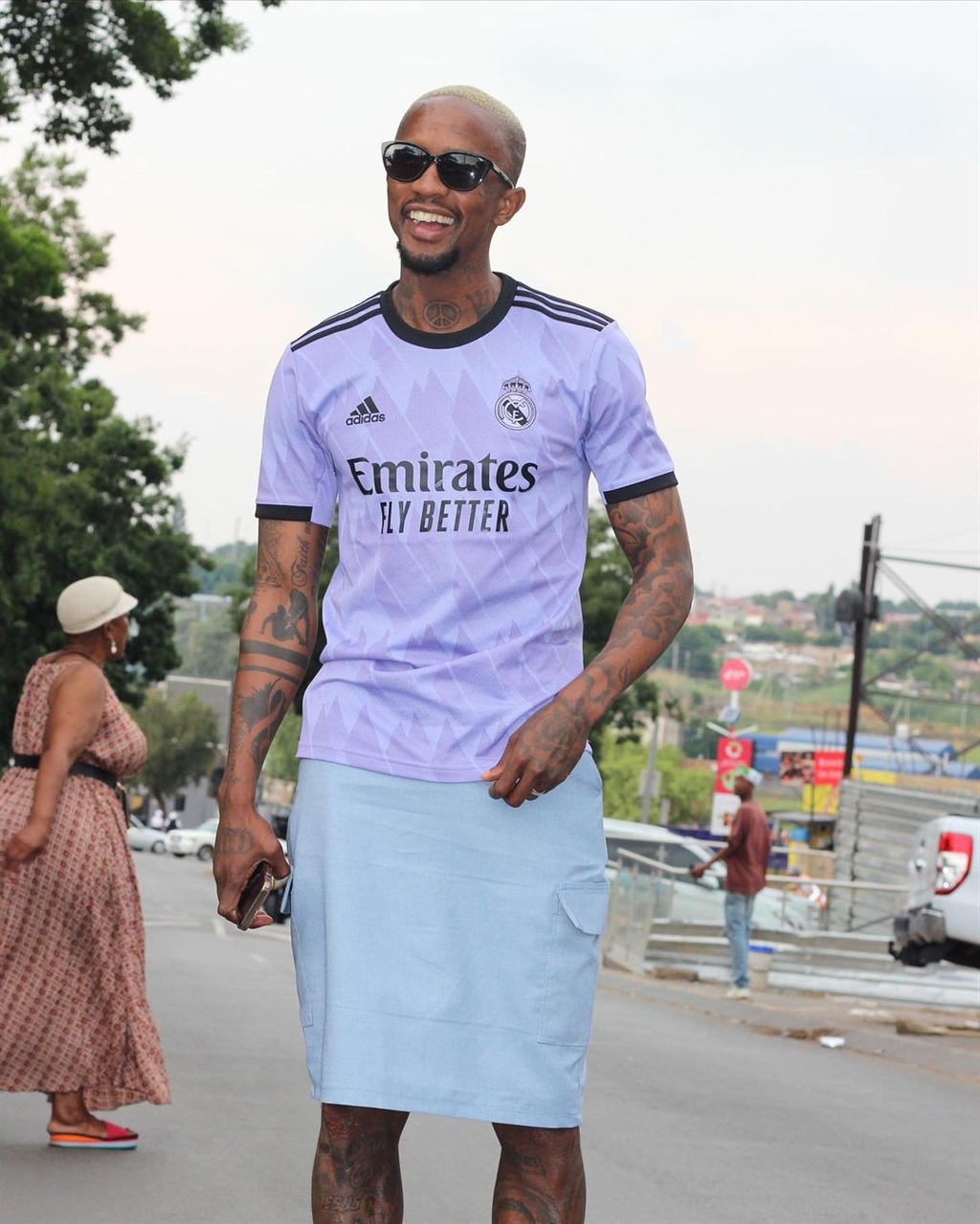 Linda Mntambo styling a Real Madrid jersey with a 